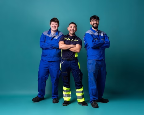Three firefighters, blue suits - GETEC